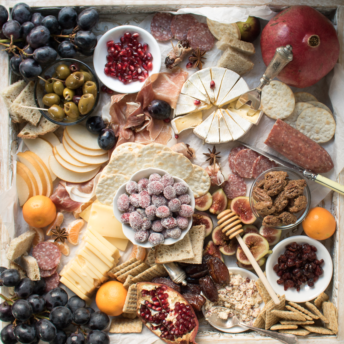 Learn how to make an Epic Charcuterie Board for impressive yet easy entertaining. This Winter Charcuterie Board is filled with meats, cheeses, veggies, nuts, olives, dried fruits, crackers, and more. An easy appetizer perfect for happy hour entertaining.