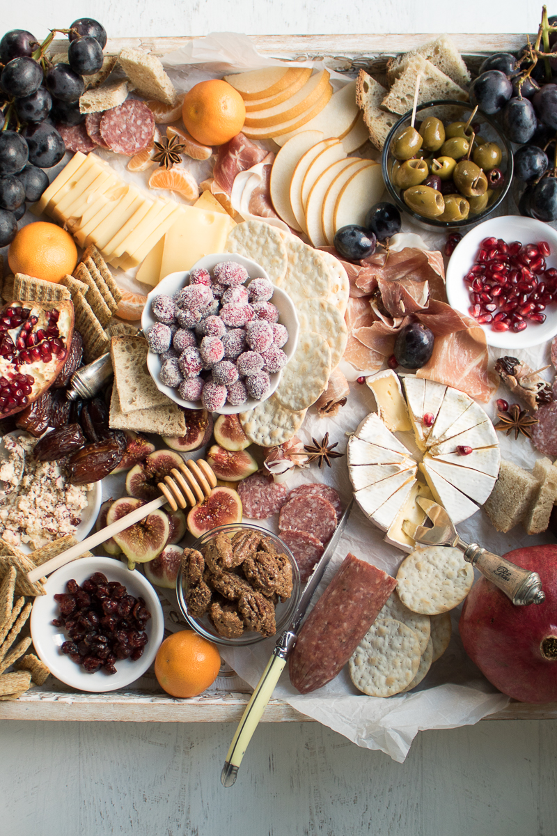 Learn how to make an Epic Charcuterie Board for impressive yet easy entertaining. This Winter Charcuterie Board is filled with meats, cheeses, veggies, nuts, olives, dried fruits, crackers, and more. An easy appetizer perfect for happy hour entertaining.
