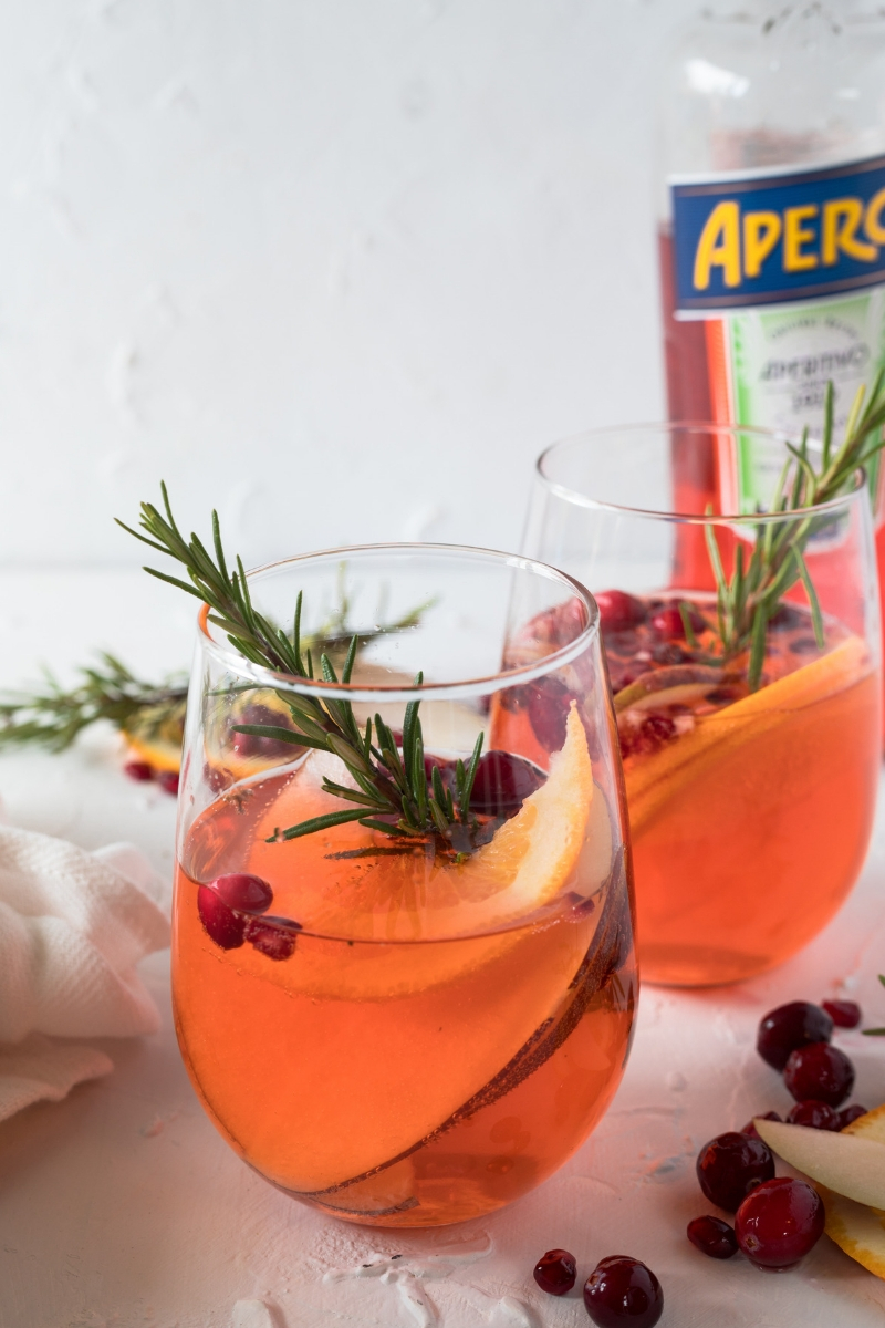 The Aperol Spritz is thought to be the quintessential summer cocktail, but Aperol's bitter citrus flavor makes it ideal for a Christmas cocktail. Perfect for easy entertaining, this Cranberry Aperol Spritz Christmas Punch is the ultimate crowd pleaser!