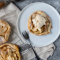 mThese Apple Galette Mini Tarts are elegantly simple and delightfully rustic. A single-serve dessert perfect for entertaining, this mini dessert includes tender-baked apple with cinnamon, topped on gorgeous, light, and buttery tart shells. Sure to impress the pickiest dessert lovers!