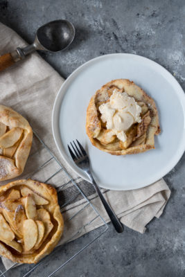 mThese Apple Galette Mini Tarts are elegantly simple and delightfully rustic. A single-serve dessert perfect for entertaining, this mini dessert includes tender-baked apple with cinnamon, topped on gorgeous, light, and buttery tart shells. Sure to impress the pickiest dessert lovers!