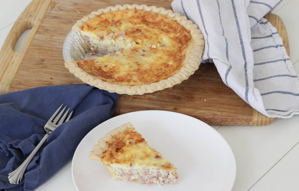 Looking for a Sunday Brunch to impress guests? This Creamy Cheesy Ham Quiche recipe is it! This classic breakfast is a one-pan meal that's simple to make and will be loved by all!
