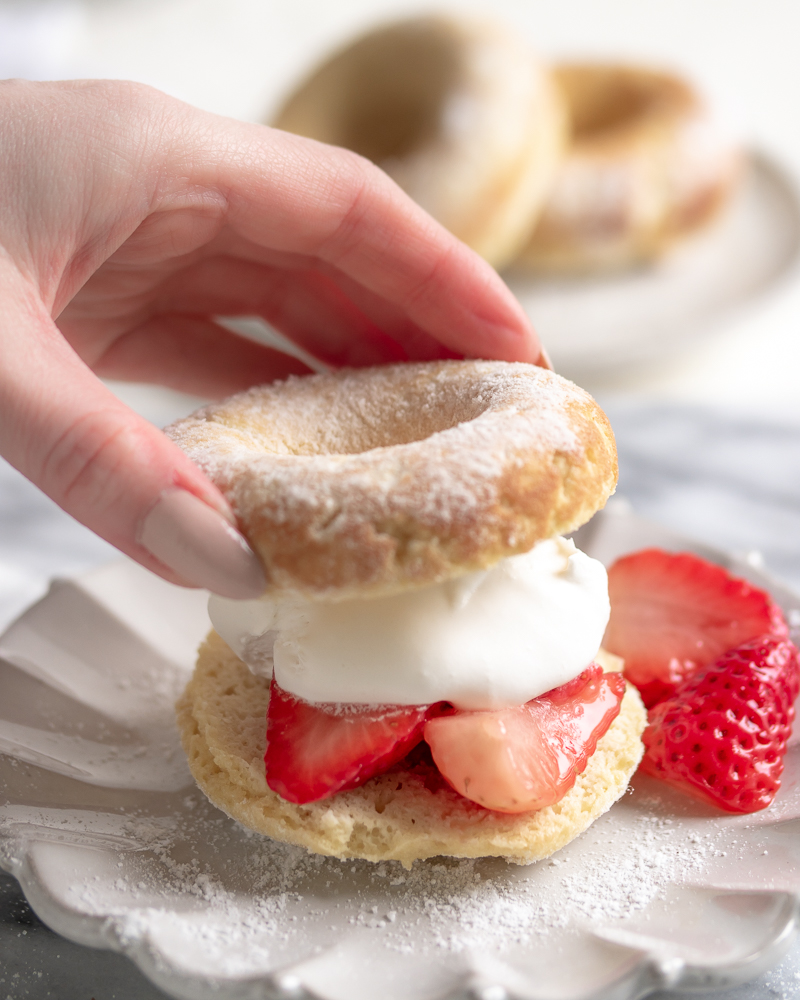 Think you can't enjoy decadent desserts on a Keto Diet? These 4-gram net carb Keto Strawberry Shortcake Donuts tell another tale! Baked to perfection, topped with no-sugar whipped cream and fresh strawberries.