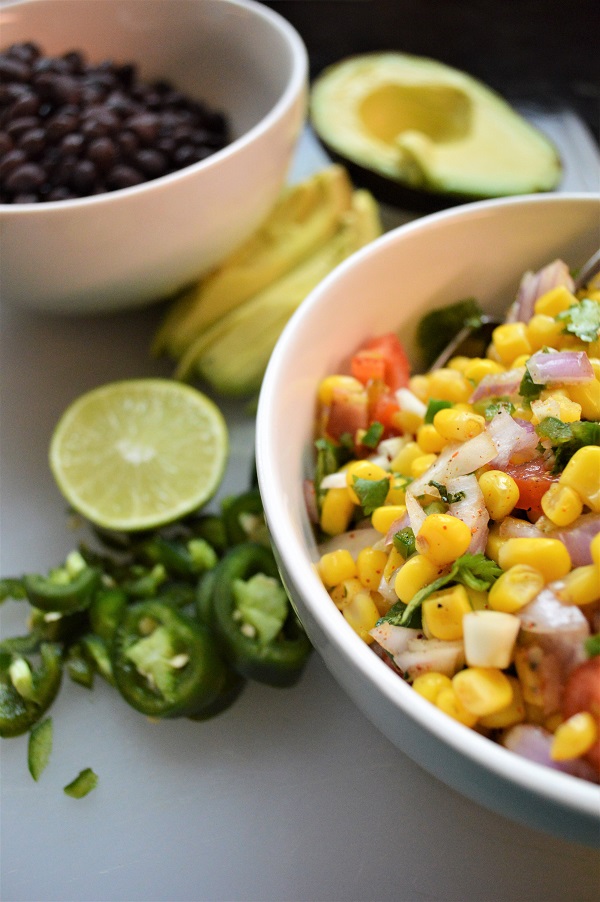 This Spicy Mexican Grits Bowl with fresh corn salsa is a healthy budget meal that doesn't sacrifice on flavor or wholesome ingredients. This classic southern dish is loaded with Mexican flare and you won't be able to beat this nutritious, hearty, meat-free meal!