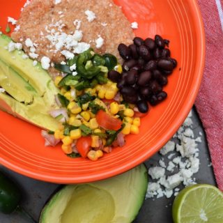This Spicy Mexican Grits Bowl with fresh corn salsa is a healthy budget meal that doesn't sacrifice on flavor or wholesome ingredients. This classic southern dish is loaded with Mexican flare and you won't be able to beat this nutritious, hearty, meat-free meal!