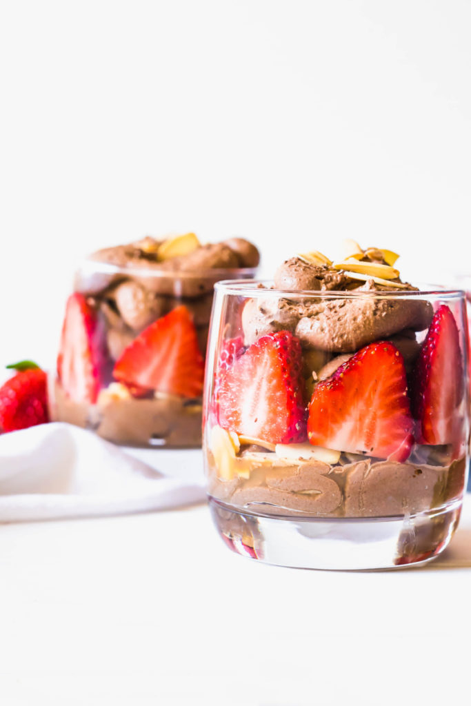 Eating better doesn't mean you have to sacrifice dessert, you just need to choose more wisely. This Chocolate Coconut Whip Parfait is a healthier dessert option that is refined sugar free. This lower calorie dessert is a dairy-free whip cream made with coconut milk, layered with fresh berries and toasted almonds.