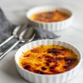Craving a classic dessert? Bring the taste of French cooking home with this Simple French Creme Brûlée Recipe - a perfect cooking for two dessert. The sweet creamy center and crunch of sugar make this gluten-free mini dessert just irresistible. It's way easier than you'd think!