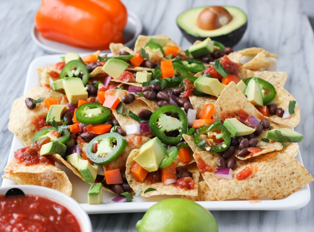 This healthier classic of traditional street food nachos uses an abundance of fresh veggies, beans, and salsa so you won’t even miss the meat or cheese. These Street Food Vegan Nachos are just like grabbing your favorite food truck indulgence, but it’s a healthier quick appetizer!