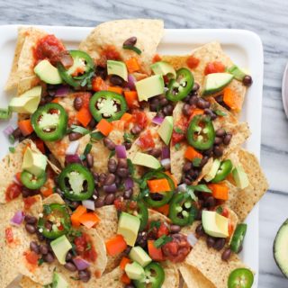 This healthier classic of traditional street food nachos uses an abundance of fresh veggies, beans, and salsa so you won’t even miss the meat or cheese. These Vegan Street Food Nachos are just like grabbing your favorite food truck indulgence, but it’s a healthier quick appetizer!