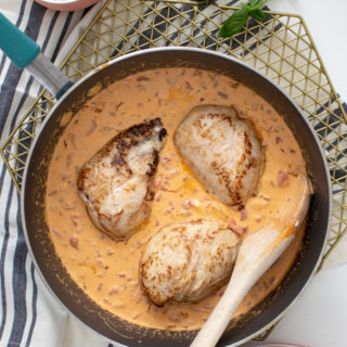 This Creamy Roasted Red Pepper Chicken is the perfect budget-friendly, 30-minute meal when you're cooking for two. Eat the chicken one night, then use the sauce leftovers for a pasta dinner the next night.