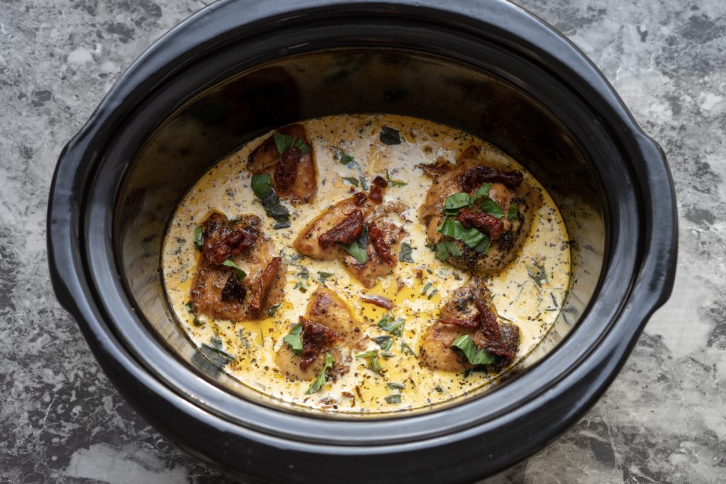 Weeknight dinner can be a struggle at times, but it doesn't have to be with this Slow Cooker Sun Dried Tomato Chicken dish. Pure comfort food in a one-pot meal. With just 15 minutes of prep time, this Crock Pot Chicken is a delicious cheap healthy meal!