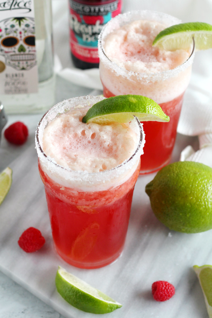 This Raspberry Beergarita Recipe is made with raspberry flavored beer and classic margarita ingredients.  It's a fruity beer cocktail that combines two popular adult beverages into one delicious drink! Just blend 6 ingredients together for the perfect spring cocktail!
