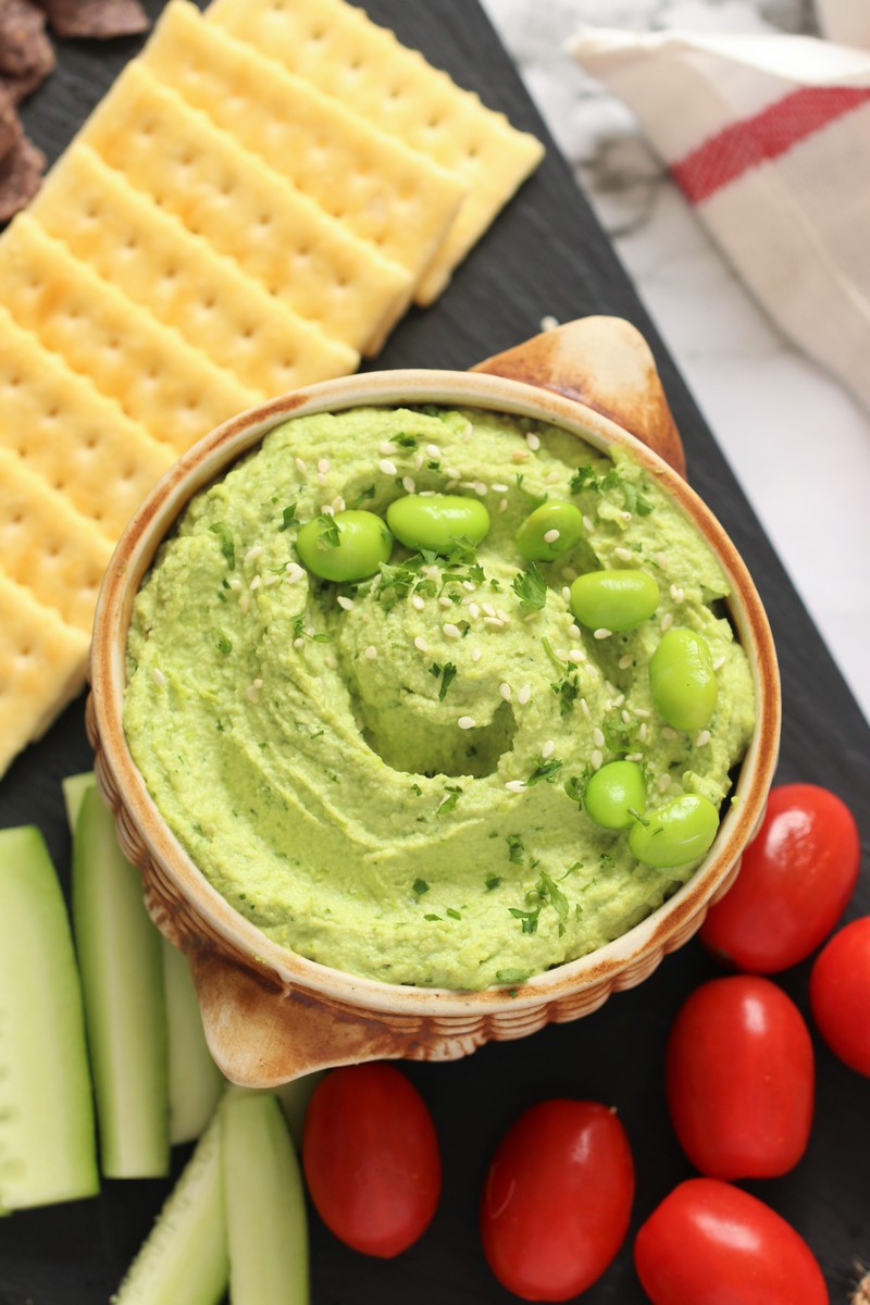 This super simple vegan and gluten free Edamame Hummus is an evergreen dip that's perfect for a healthy appetizer, sandwich spread or as a delicious midday snack!