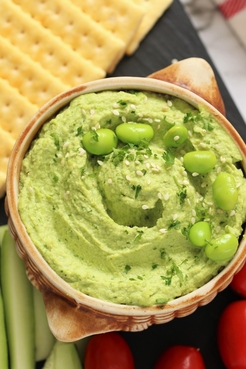 This super simple vegan and gluten free Edamame Hummus is an evergreen dip that's perfect for a healthy appetizer, sandwich spread or as a delicious midday snack!