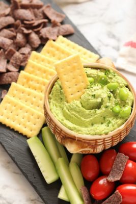 This super simple vegan and gluten free Edamame Hummus is an evergreen dip that's perfect for a healthy appetizer, sandwich spread, or as a delicious midday snack!