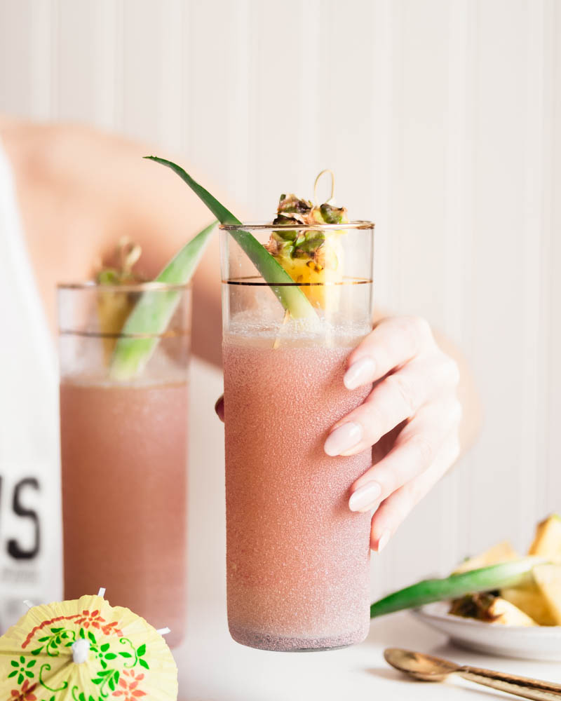 As the weather warms up, it's time for more outdoor entertaining and what better way to celebrate than with a 5-ingredient healthier cocktail? This Fizzy Pineapple Kombucha Cocktail is the summer cocktail dreams are made of!