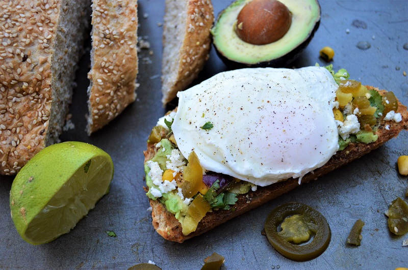 Ditch that bowl of cereal when you enjoy simple clean eating with this Southwest Avocado Toast with Poached Eggs. The southwest flavors in this 20-minute meal make this healthy breakfast a fun and spicy way to start your busy day!