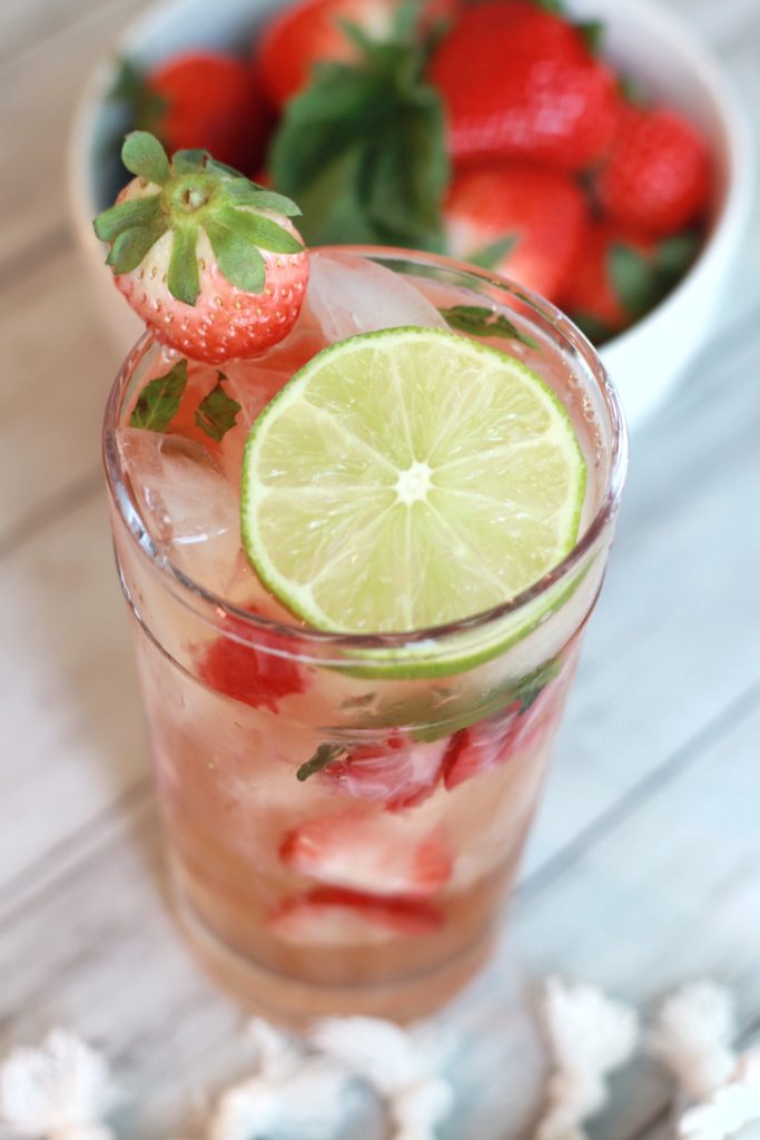 Impress guests for a happy hour at home with this simple Strawberry Basil Chelada recipe. A 4-ingredient cocktail that's presentation is as lovely as the ease of preparation. With Mexican beer, tequila, strawberries, and basil, you'll look like a master mixologist!
