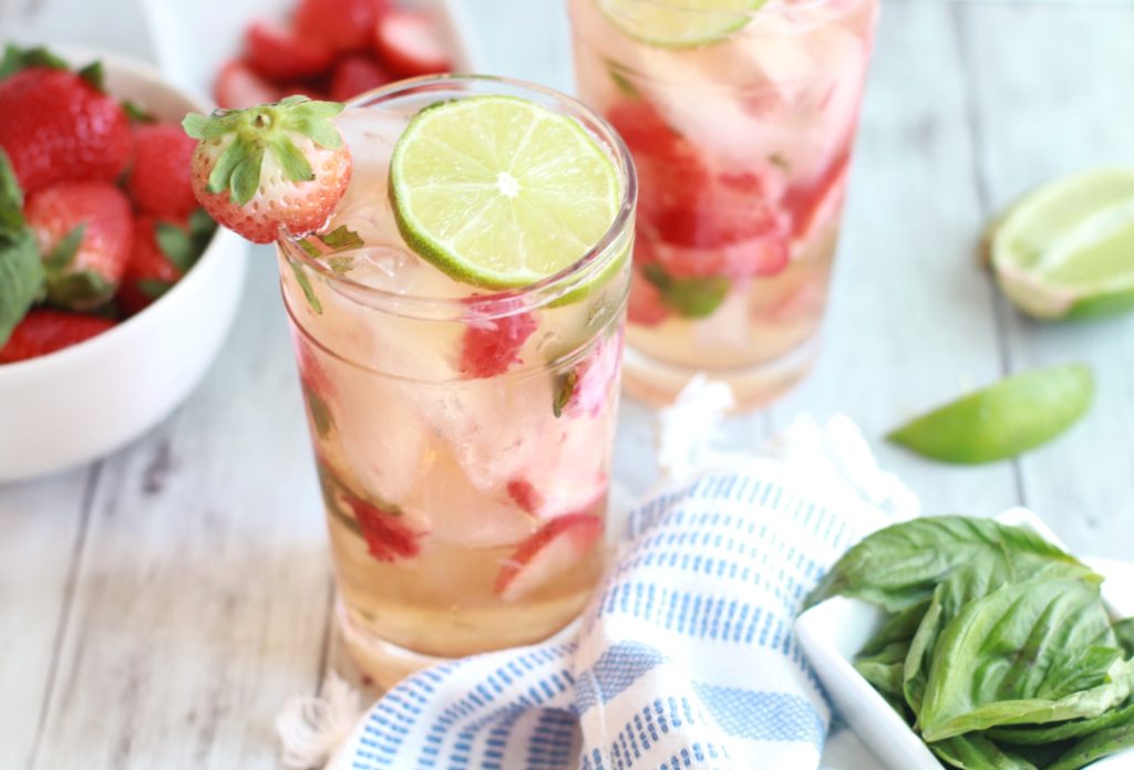 Impress guests for a happy hour at home with this simple Strawberry Basil Chelada recipe. A 4-ingredient cocktail that's presentation is as lovely as the ease of preparation. With Mexican beer, tequila, strawberries, and basil, you'll look like a master mixologist!