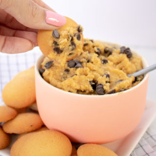 With 10 minutes and a few pantry staples, you'll transform traditional hummus into this Chocolate Chip Cookie Dough Dessert Hummus! A gluten-free appetizer or healthier dessert that's perfect for summer entertaining since there's no baking involved!