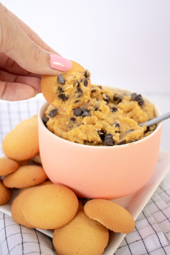 With 10 minutes and a few pantry staples, you'll transform traditional hummus into this Chocolate Chip Cookie Dough Dessert Hummus! A gluten-free appetizer or healthier dessert that's perfect for summer entertaining since there's no baking involved!