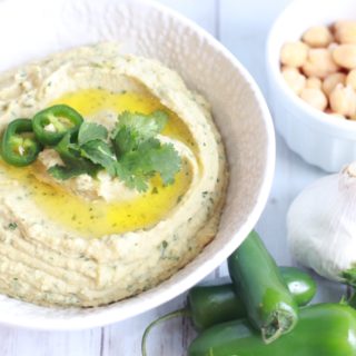 Talk about an easy appetizer! This Instant Pot Cilantro Jalapeño Hummus uses dried chickpeas to create a creamy hummus full of flavor in about an hour. Using the pressure cooker means no soaking of the garbanzo beans is required!