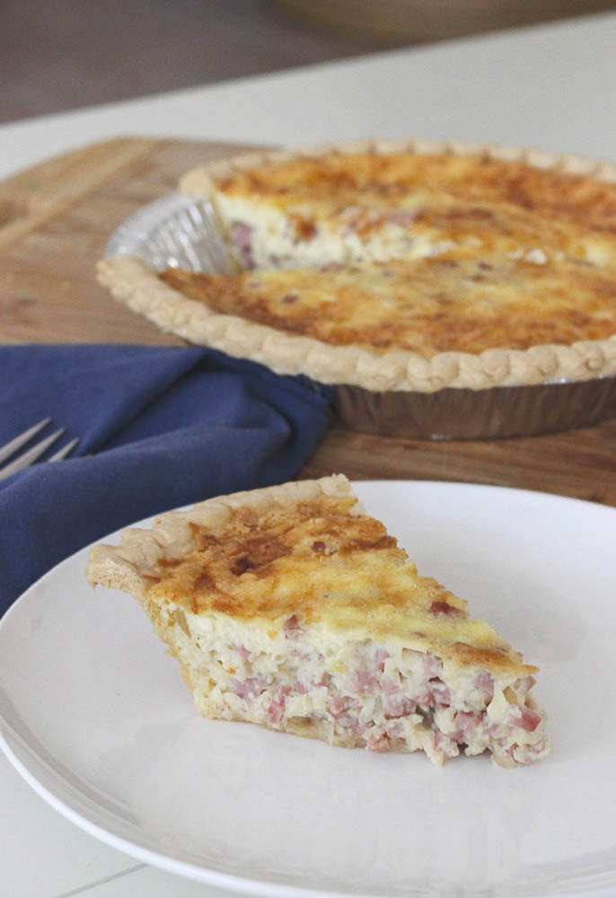 Looking for a Sunday Brunch to impress guests? This Creamy Cheesy Ham Quiche recipe is it! This classic breakfast is a one-pan meal that's simple to make and will be loved by all!