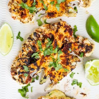 What gets you most excited about grilling season? If you said hamburgers or steaks, you're missing out on the magic of outdoor grilling season! Grilled vegetables are delicious with a good set of grill marks, and these Chipotle Lime Grilled Cauliflower Steaks are sure to become a family favorite!