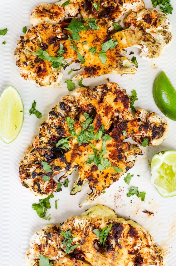What gets you most excited about grilling season? If you said hamburgers or steaks, you're missing out on the magic of outdoor grilling season! Grilled vegetables are delicious with a good set of grill marks, and these Chipotle Lime Grilled Cauliflower Steaks are sure to become a family favorite!