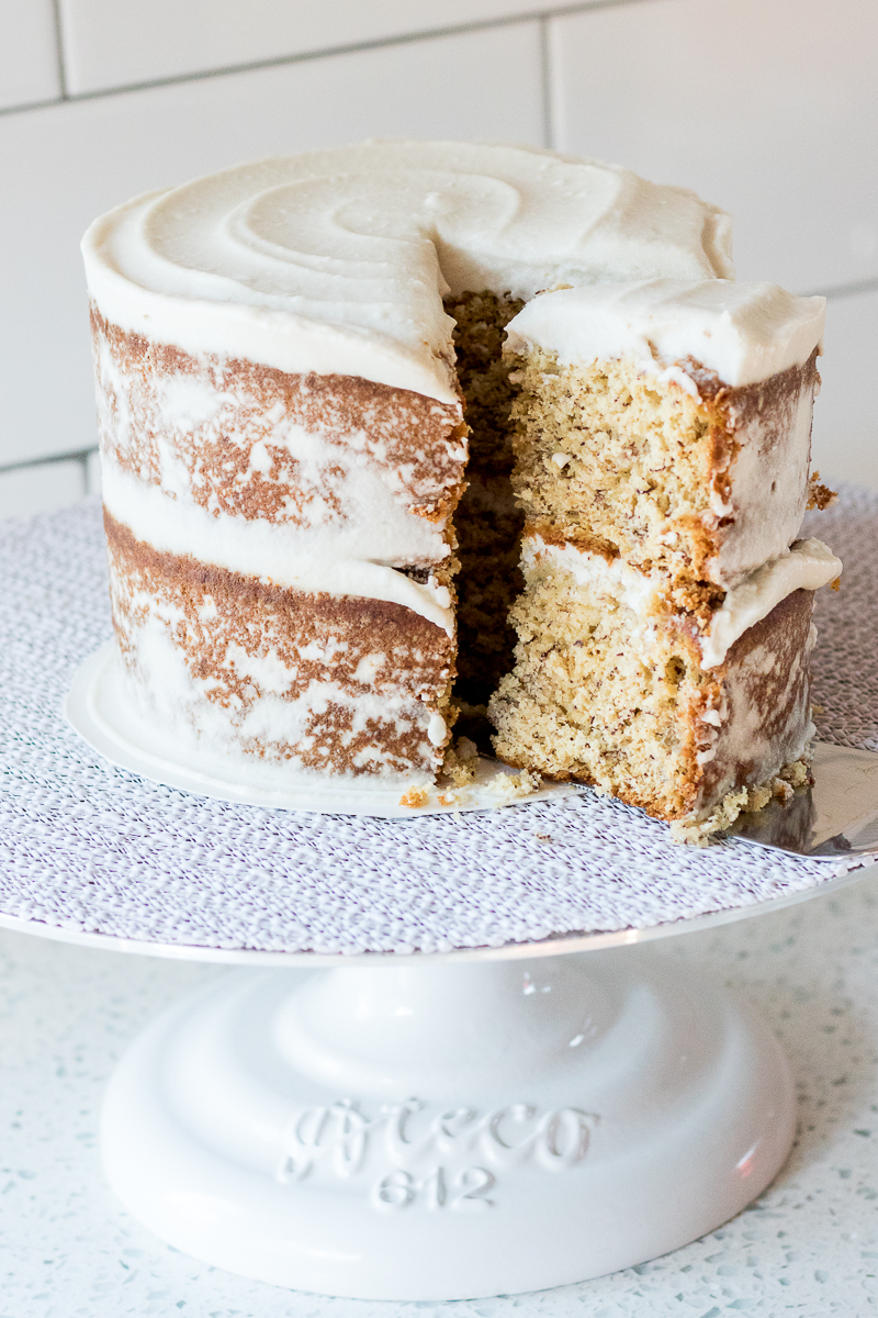 Banana Bread Cake {gluten-free option} is a healthier cake recipe you'll feel good about. A double layer cake with naturally-sweet Vegan Coconut Frosting.