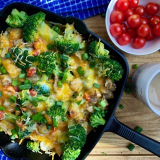 If you're looking for an easy weeknight dinner, turn to your cast iron skillet for this 30-minute meal. This Broccoli Tater Tot Skillet Casserole uses turkey sausage, cheesy broccoli, tater tots, and tomatoes for a one-pan meal that has it all.
