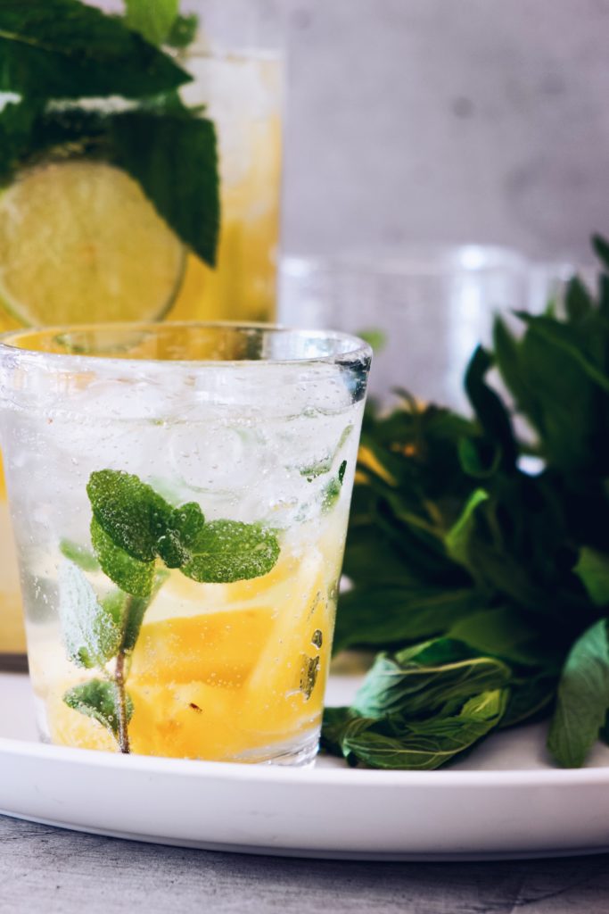 Introducing the Lemon Ginger Rogers Cocktail, destined to be a modern classic cocktail! A refreshing gin and ginger ale cocktail with ginger syrup and mint. This simple gin cocktail is perfect for summer entertaining!