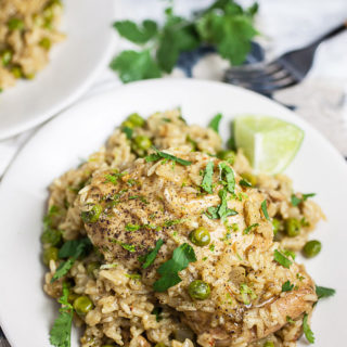 This Skillet Coconut Chicken and Rice is the perfect easy cast iron skillet dinner! It's got juicy chicken thighs, fragrant rice, and fresh herbs. A one-pan meal the whole family will love!
