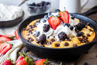Kick up your Sunday brunch game when you make this impressive Cast Iron Chocolate Chip Pancake. Fluffy pancake batter is baked to perfection in about 30 minutes in your cast iron skillet. Top with your favorite farmers market fruit!
