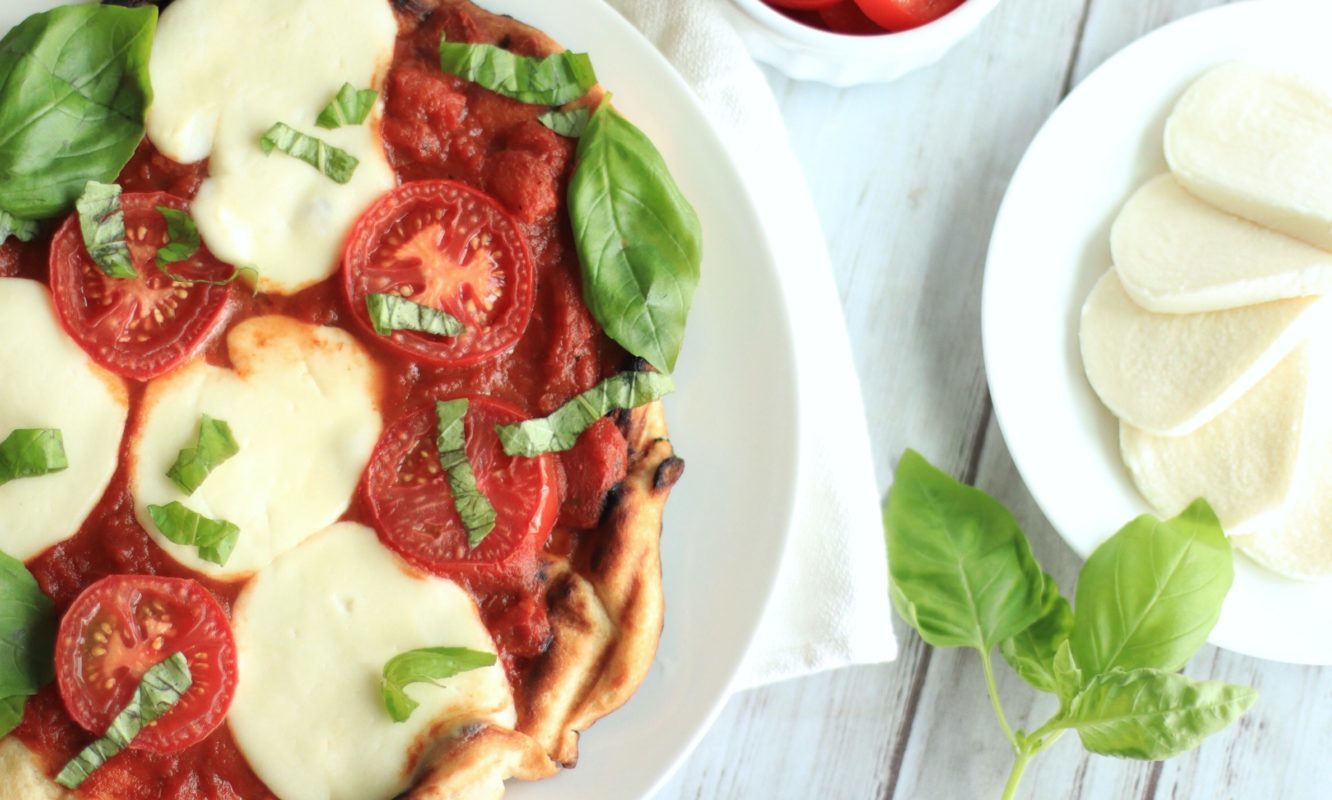 This easy grilled pizza recipe takes just 15 minutes. Whether you decide to grill a Caprese Pizza or a meatier variety, grilled pizza takes outdoor grilling to a new level. The homemade pizza dough really makes the meal!