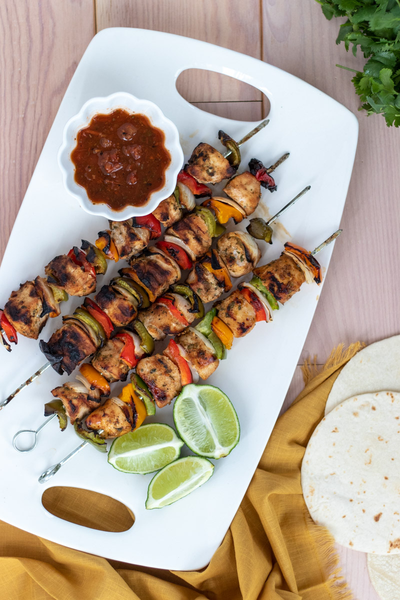 Outdoor grilling season is here so there's no need to heat up the kitchen! Marinade these Grilled Chicken Fajita Kabobs the night before and enjoy a short 15 minute cook time before dinner. Chicken and vegetables never tasted so good!