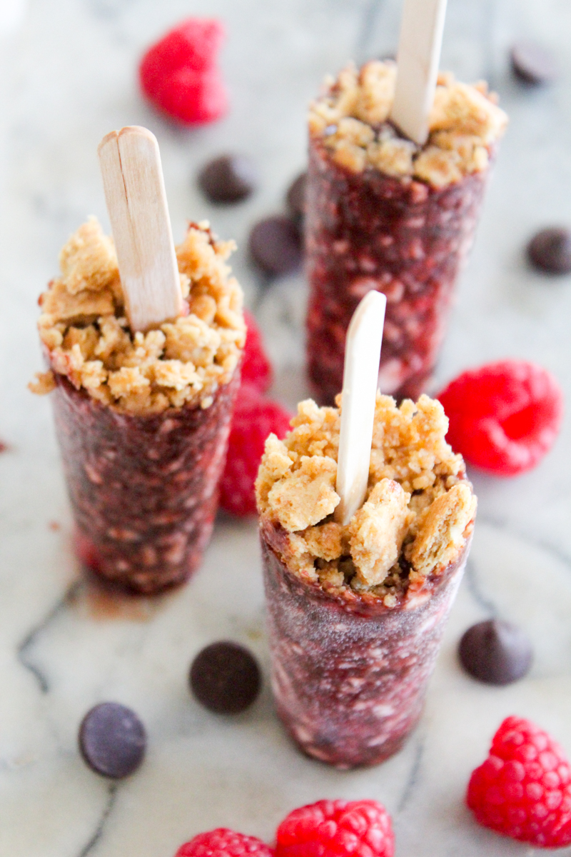 There's no better summer treat than a no-bake dessert! These Chocolate Raspberry Cheesecake Popsicles are creamy, cool, and refreshing. Just like traditional cheesecake only cold and on a stick!