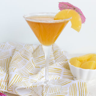This Pineapple Martini is a tropical twist on a classic cocktail. With real pineapple juice and vermouth, this vodka-based cocktail is the perfect adult-only summer refresher.