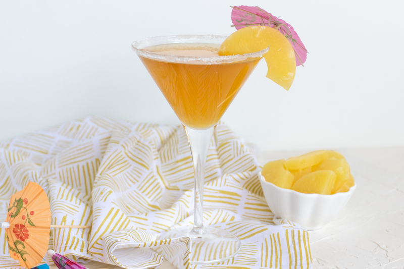 This Pineapple Martini is a tropical twist on a classic cocktail. With real pineapple juice and vermouth, this vodka-based cocktail is the perfect adult-only summer refresher.