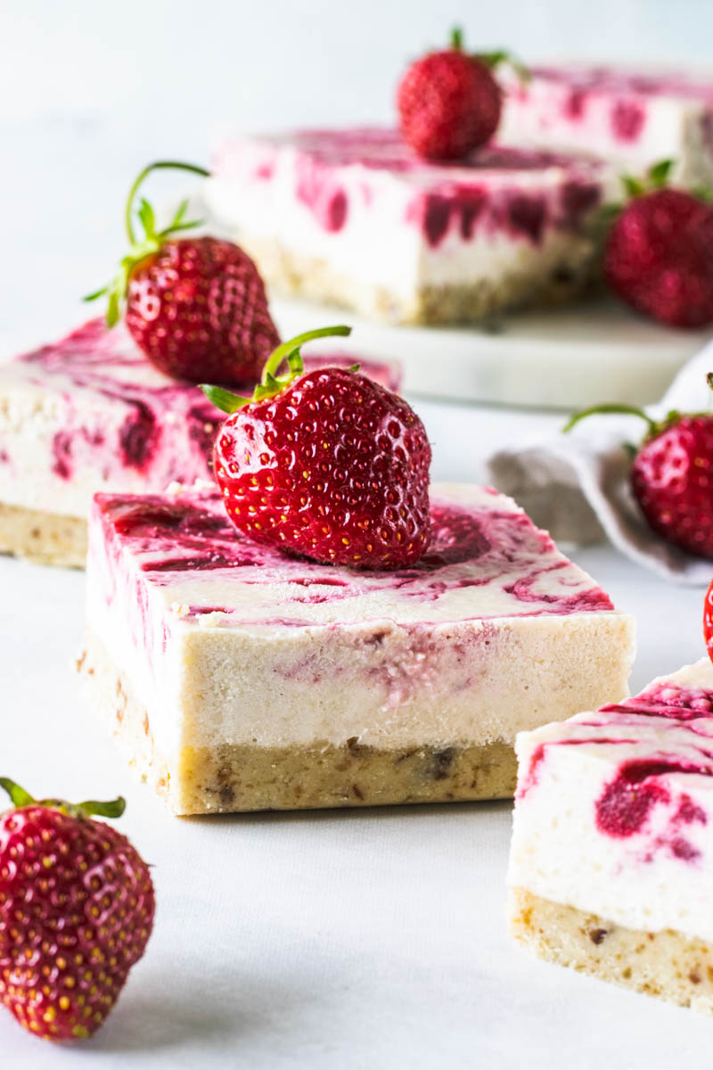 These No-Bake Vegan Strawberry Cheesecake Bars are dairy free, paleo, gluten free, and refined sugar free. Creamy and delicious with just the right amount of sweetness for you to enjoy a farmers market inspired dessert!