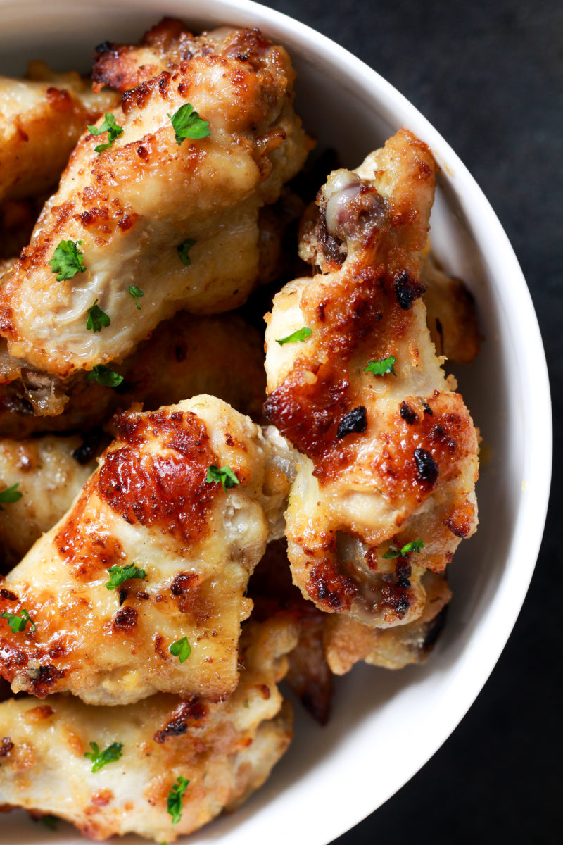 These Garlic Air Fryer Chicken Wings cook up incredibly crispy and juicy without deep frying! Serve as a weeknight meal or party appetizer with homemade garlic ranch dipping sauce. Ready in about 15 minutes!