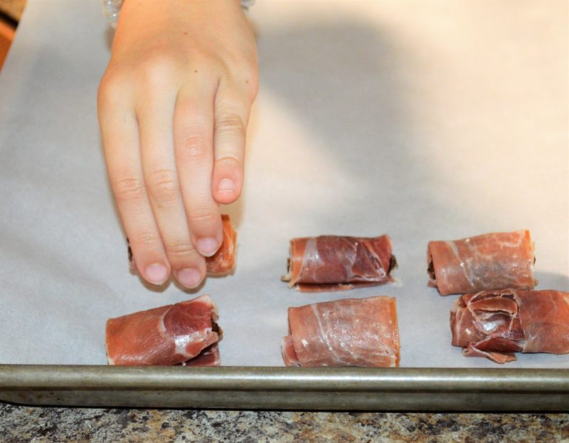 Healthy snacking is simple with these Baked Prosciutto Wrapped Dates. Cut, wrap, and bake is all it takes for this sweet salty snack that's great for a mid-day snack craving, party appetizer, or after school snack.