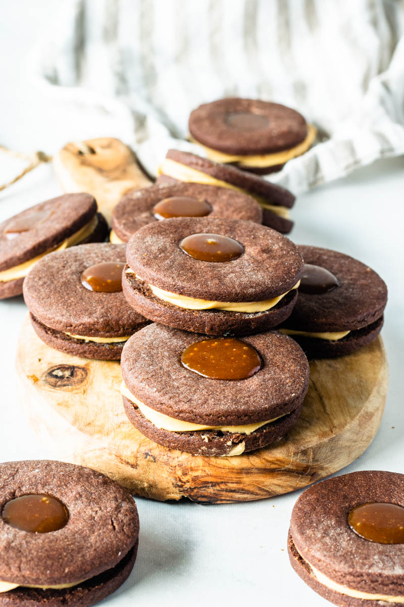 Enjoy these Vegan Salted Caramel Cookies with homemade caramel sauce. These non-dairy cookies are a decadent fall dessert everyone will love. Perfect for parties, potlucks, or food gifts with everyone's favorite fall flavors.