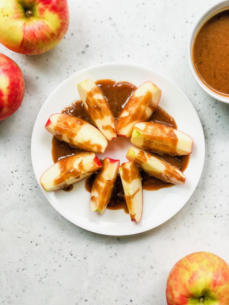 Date-Sweetened Vegan Caramel Apples are a healthy afternoon snack. The dairy-free caramel sauce is ready in 15 minutes with 6 wholesome ingredients. A healthier classic to a traditional fall flavors dessert.