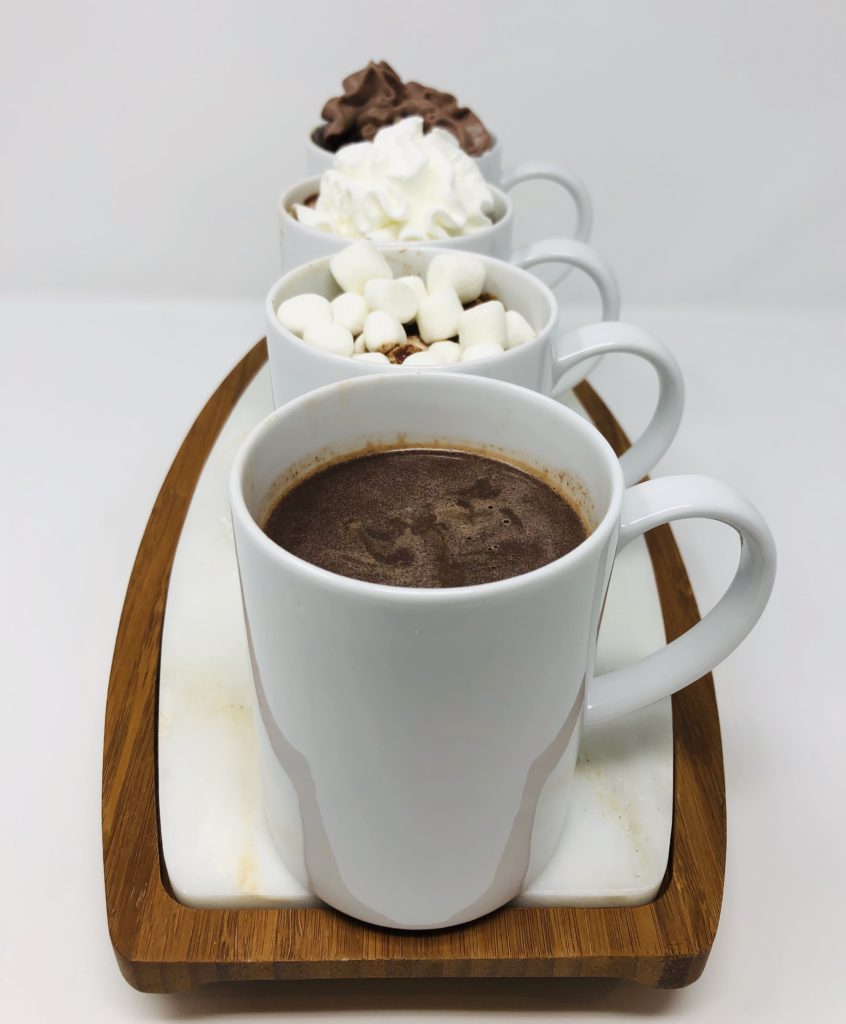 Cold weather calls for a warm, comforting drink! This Spiked Mexican Hot Chocolate has Kahlua, cayenne, and cinnamon, and is topped with whipped cream and chocolate syrup for the ultimate winter cocktail.