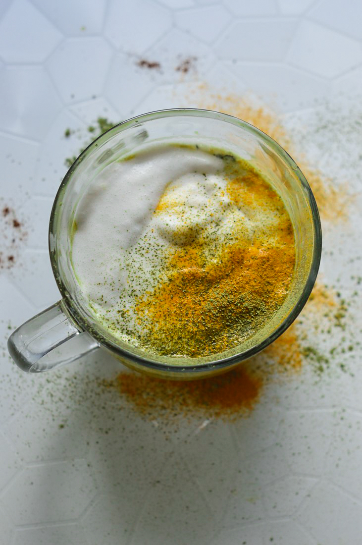 Enjoy a boost of caffeine and give your body a winter detox with this Matcha Turmeric Latte. A dairy-free, refined sugar-free, coffeehouse drink that's simple to make, provides your body with antioxidants, and soothes inflammation.
