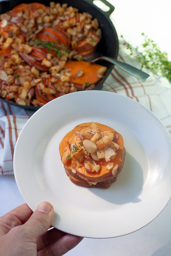 Looking to be the potluck hero this year? This Savory Sweet Potato Apple Bake is full of fall flavors and perfect as a holiday side dish. A one-pan dish flavored with fresh thyme and warming spices.