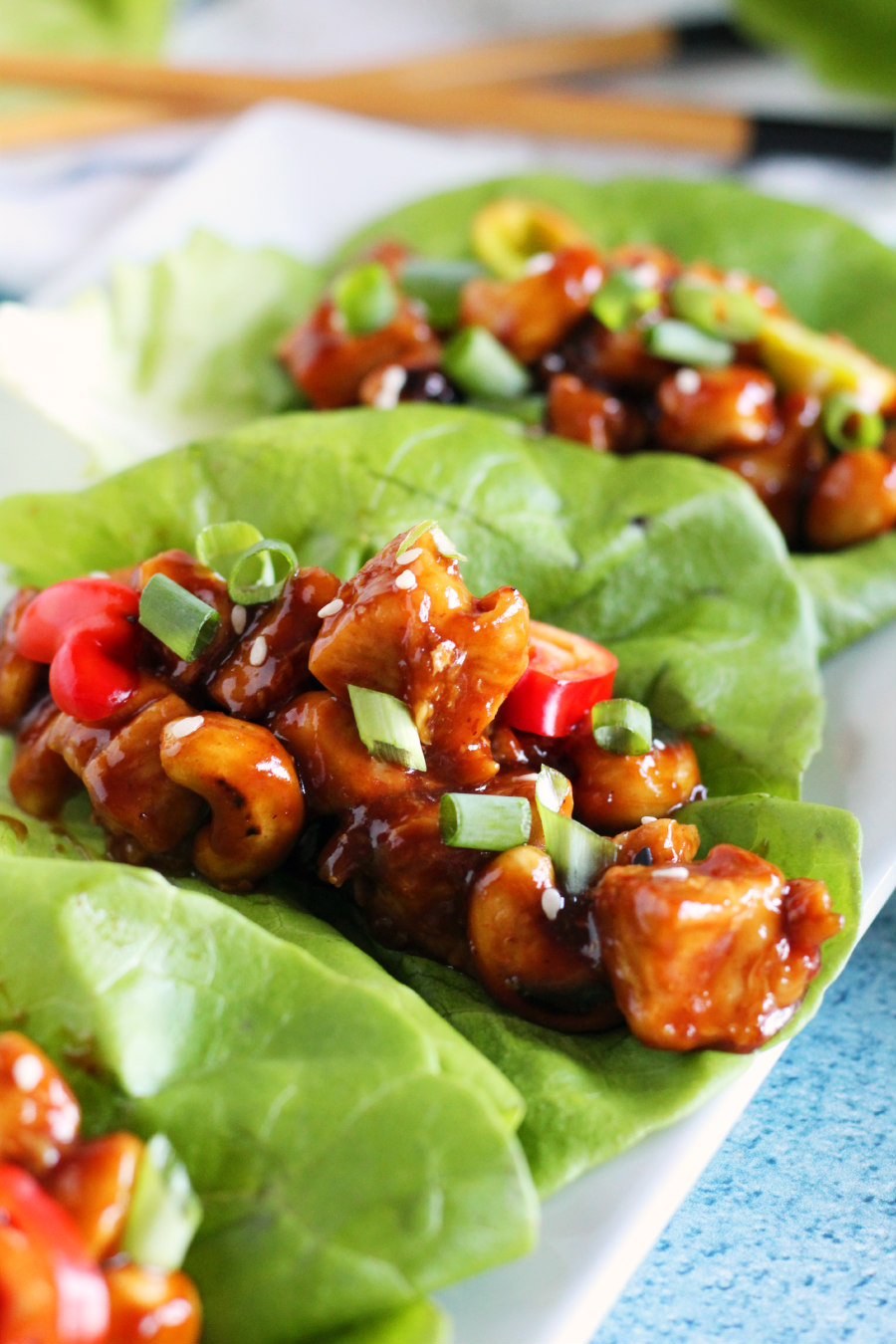 Craving Asian cuisine without the takeout price tag? Try these simple Cashew Chicken Lettuce Wraps; a budget-friendly, one-pan, 30-minute meal. Perfect for a busy weeknight meal, this dish is a healthier classic packed with Asian-inspired flavor!