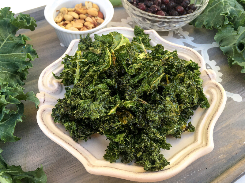 Craving something salty and satisfying? Don't reach for that greasy bag of chips! Did you know you could make 5-Minute Microwave Kale Chips? A healthy snack that's the perfect combo of crispy, salty, and satisfying!