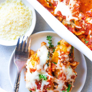 These Beef Lasagna Stuffed Shells are a budget-friendly meal. This simple dinner alternative to classic lasagna uses jumbo pasta shells stuffed with a beefy mozzarella and ricotta cheese filling that are baked in the oven for 45 minutes. 